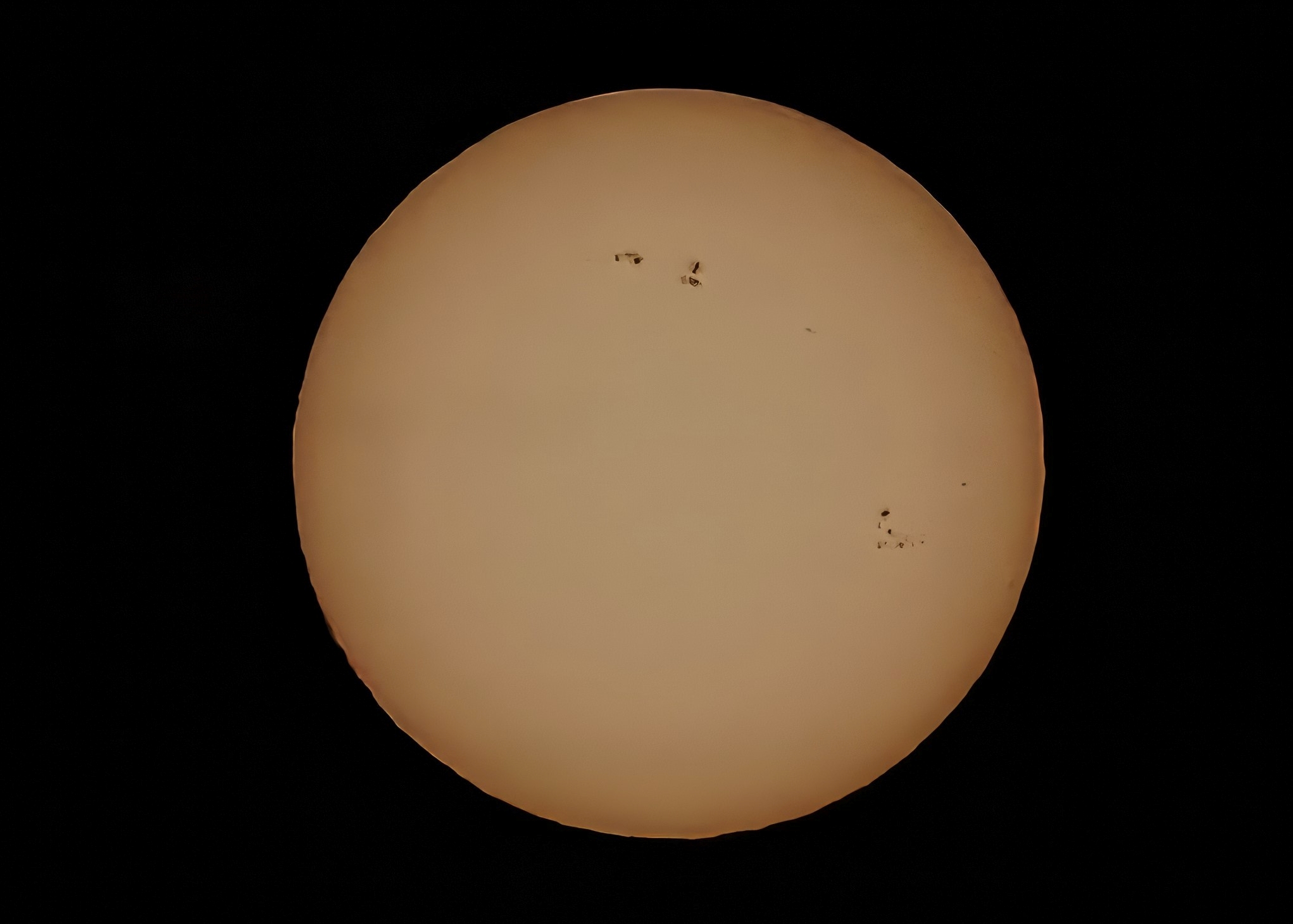 Sun with sunspots above Hermon, ME  Jan 23, 2024 - Jeff Cunningham
